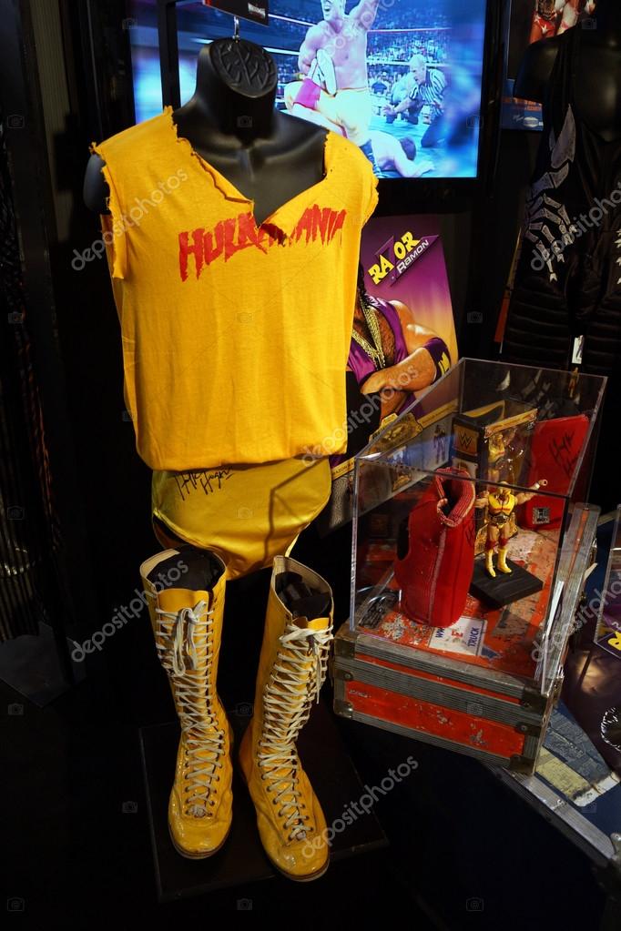SAN JOSE - MARCH 28: WWE Legend Hulk Hogan Hulkamania yellow outfit, boots, action figure and posters on displays at WWE Axxess event at the McEnery Convention Center in San Jose, California on March 28, 2015.