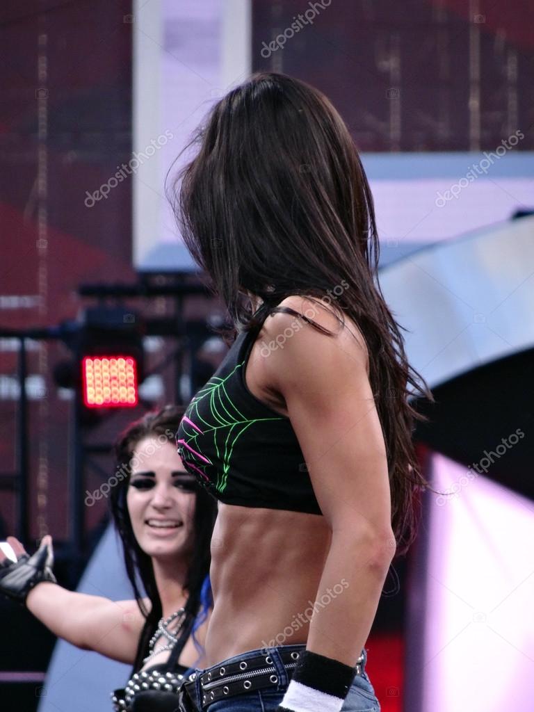 SAN CLARA - MARCH 29: Tag team partners AJ Lee and Paige look at each other at standing at the top rope after match at Wrestlemania 31 match at the Levi's Stadium in San Clara, California on March 29, 2015.