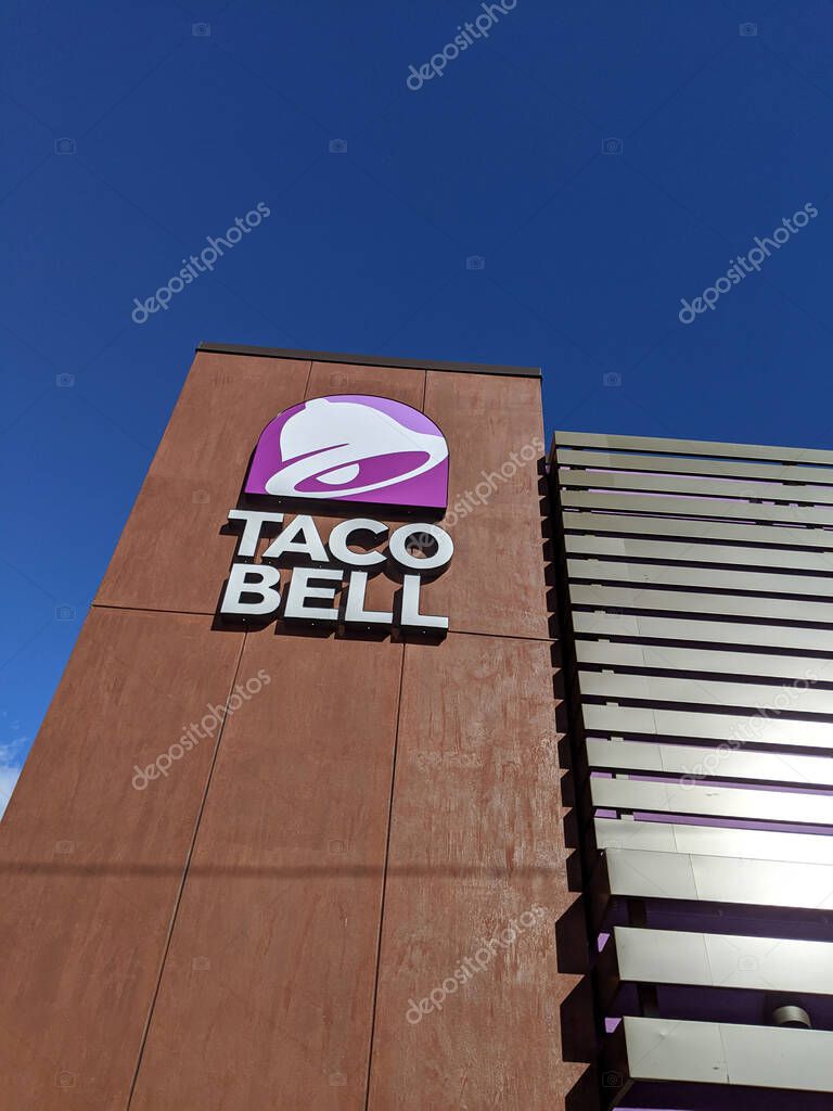 Honolulu - July 31, 2020: Taco Bell Restaurant Sign on side of building in Kalihi in Honolulu, Hawaii.