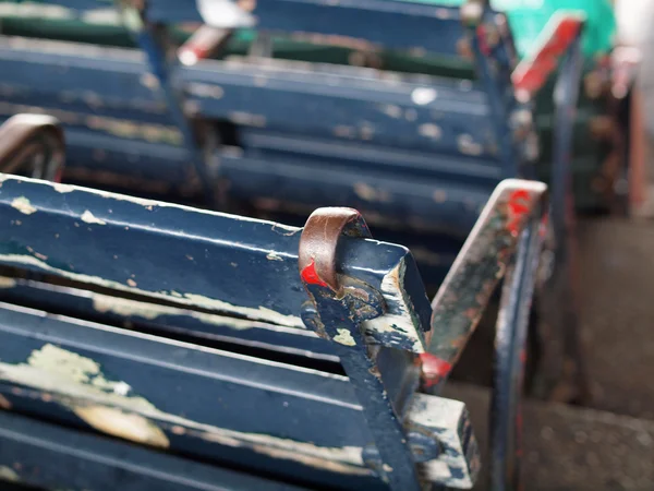 Old Baseball park seat with chipping blue paint — Stock Photo, Image