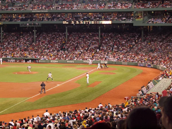 Athletics Pitcher throws a pitch to Red Sox batter as he swings — Stock Photo, Image