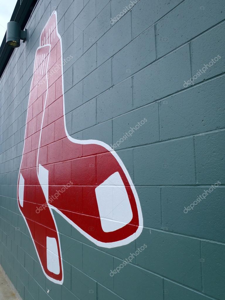 BOSTON - JUNE 2: Red Sox historic baseball logo painted on a green brick wall at Fenway Park on June 2, 2010 in Boston, Massachusetts.