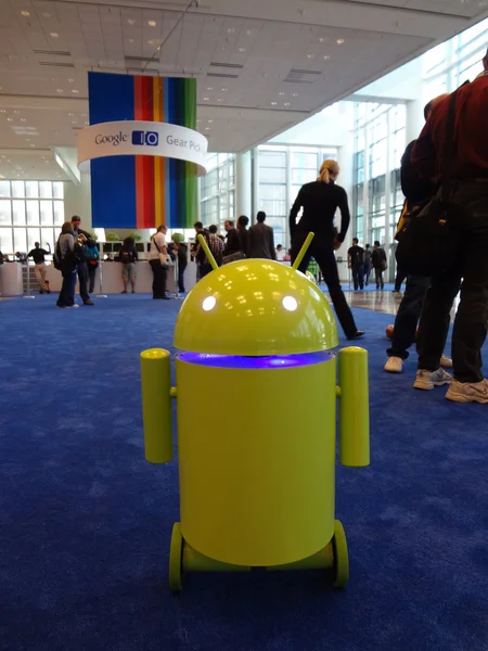 Yellow-green Android robot rolls around at the Google IO Android — Stock Photo, Image