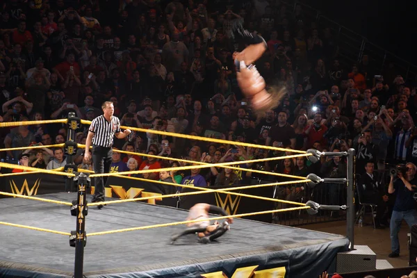Adrian Neville flips in the air as he performs the red arrow as — Stock Photo, Image