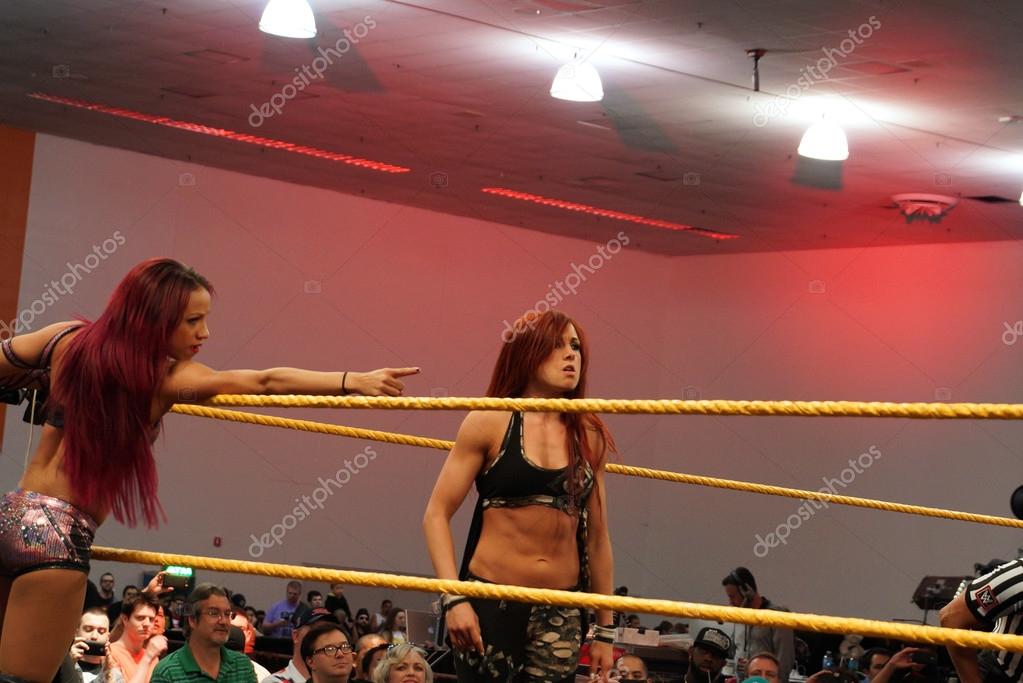 SAN JOSE - MARCH 28: Female wrestlers Becky Lynch and Sasha Banks in corner of ring during tag team matchat WWE Axxess event at the McEnery Convention Center in San Jose, California on March 28, 2015.