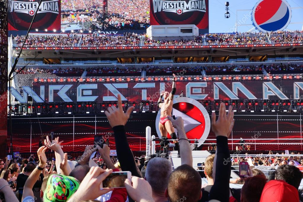 SANTA CLARA - MARCH 29: Randy Orton poses on turnbuckle as fans cheer and record action on phones before match at Wrestlemania 31 at the Levi's Stadium in San Clara, California on March 29, 2015.