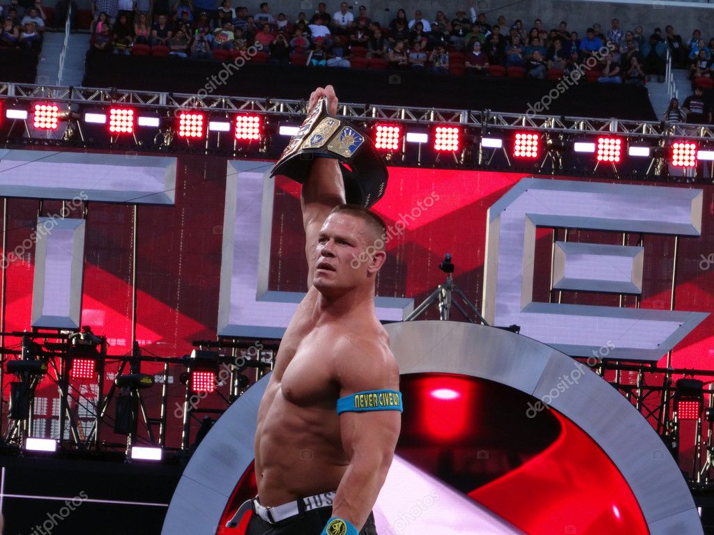 SANTA CLARA - MARCH 29: WWE Wrestler John Cena holds up USA Championship title after winning match at Wrestlemania 31 at the Levi's Stadium in Santa Clara, California on March 29, 2015.
