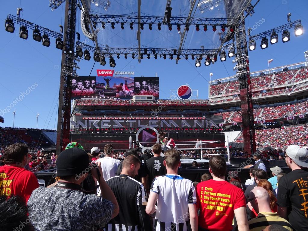 SANTA CLARA - MARCH 29: WWE Kofi Kingston jumps off the ropes to do a tag move with Big E during tag team championship match at Wrestlemania 31 pre show at the Levi's Stadium in San Clara, California on March 29, 2015.