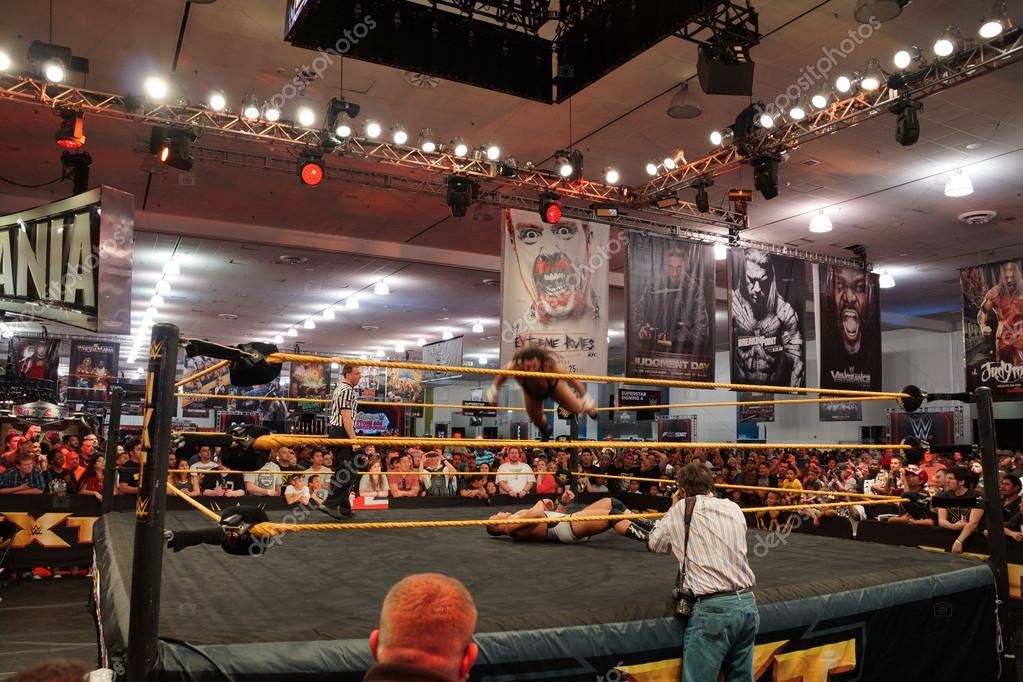 SAN JOSE - MARCH 28: NXT Wrestle Bull Dempsey jump off ropes on to opponent Jason Jordan in ring during match at WWE Axxess event at the McEnery Convention Center in San Jose, California on March 28, 2015.