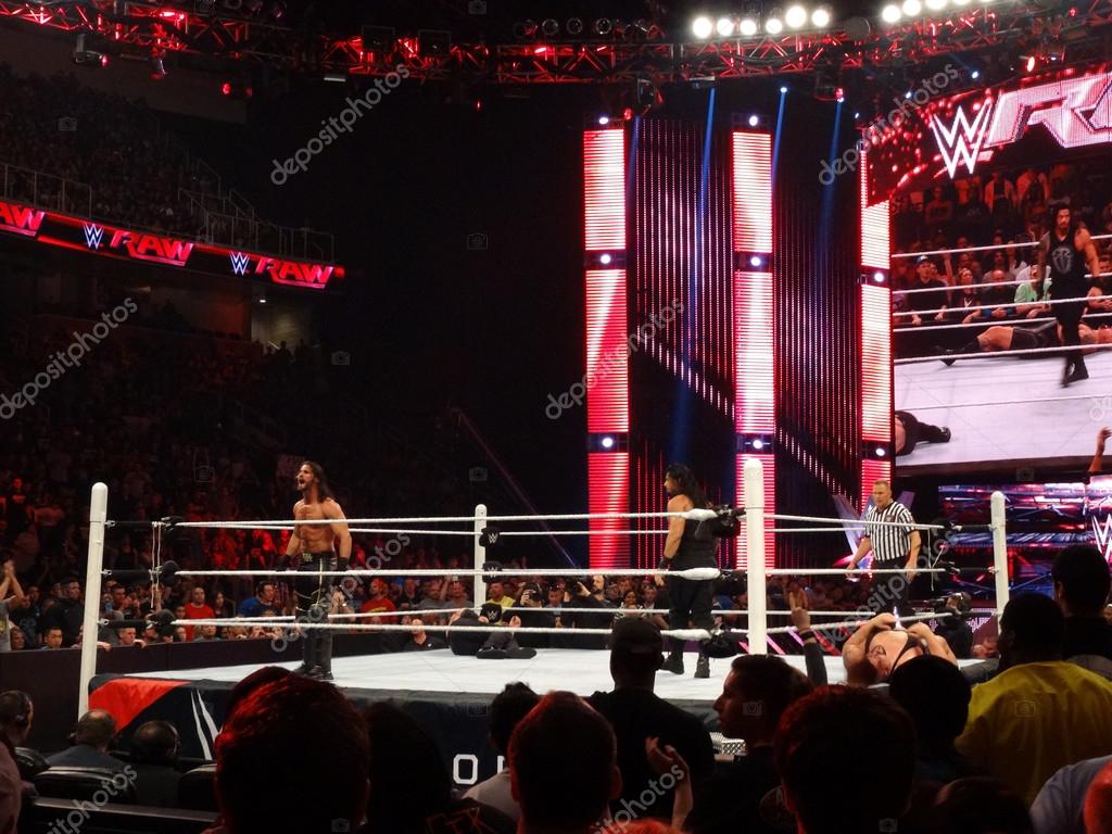 SAN JOSE - MARCH 30:  WWE Wrestler Seth Rollins screams at crowd as Roman Reigns stares at him in the ring during live taping of WWE Monday Night Raw at the SAP Center in San Jose, California on March 30, 2015.