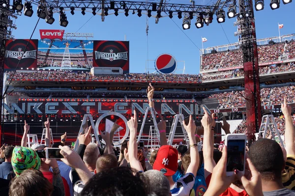 Daniel Bryan celebrates with yes chant with fans on top of ladde — Stock Photo, Image