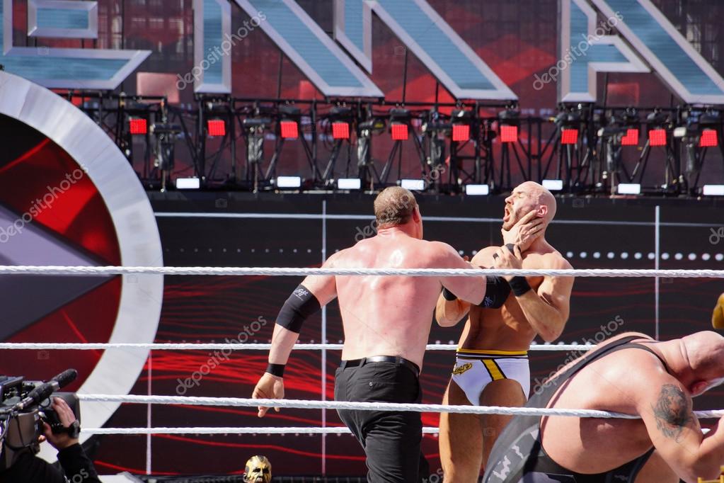 SANTA CLARA - MARCH 29: WWE Wrestler Kane puts hand around neck of Cesaro to setup for a chokeslam during andre the giant battle royal 2015 at Wrestlemania 31 at the Levi's Stadium in Santa Clara, California on March 29, 2015.