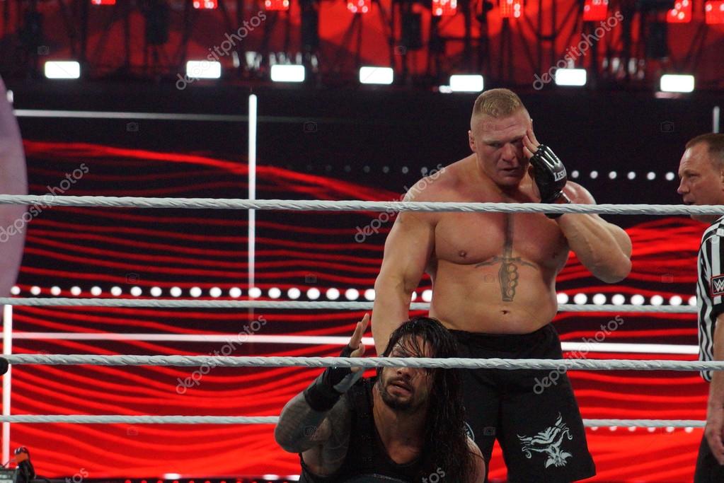 SANTA CLARA - MARCH 29: WWE Champion Brock Lesner holds face as he grabs Roman Reigns who holds hand out at Wrestlemania 31 at the Levi's Stadium in Santa Clara, California on March 29, 2015.