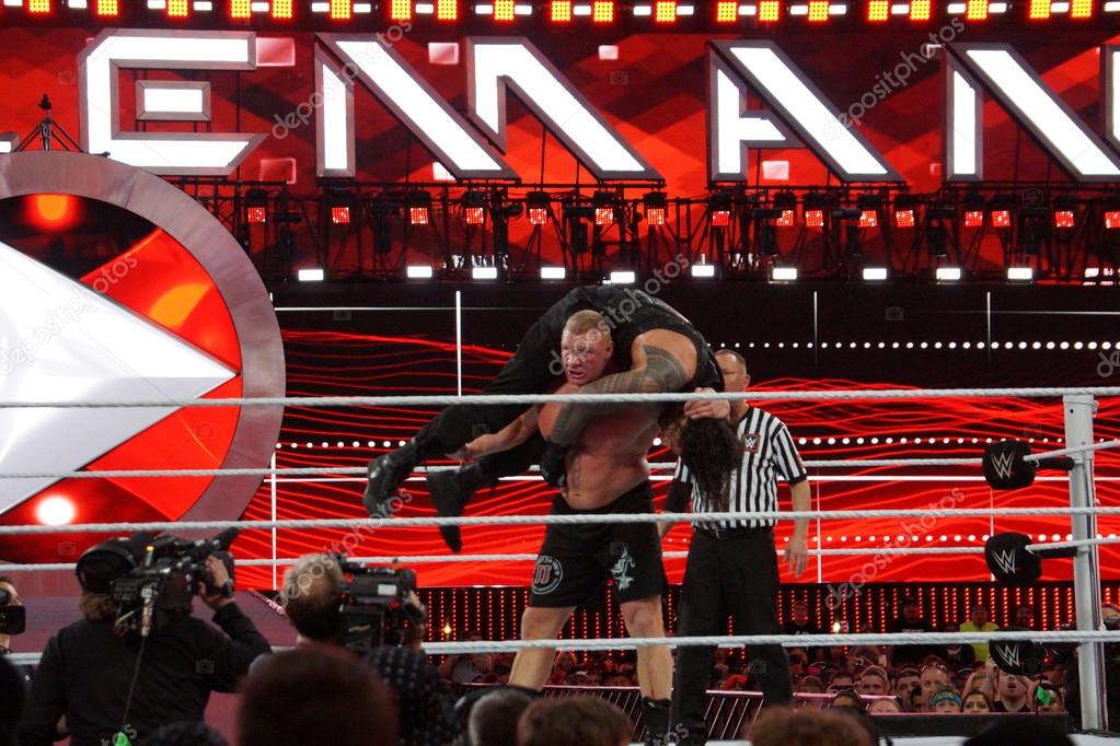 SANTA CLARA - MARCH 29: WWE Champion Brock Lesner sets up to F-5 Roman Reigns by placing him on top of his shoulders at Wrestlemania 31 at the Levi's Stadium in Santa Clara, California on March 29, 2015.