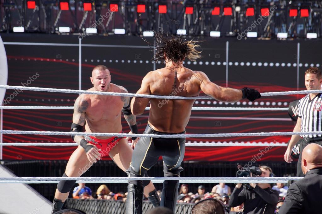 SANTA CLARA - MARCH 29: WWE Wrestler Seth Rollins bounces off the ropes as Randy Orton sets to bend down in the ring at Wrestlemania 31 at the Levi's Stadium in Santa Clara, California on March 29, 2015.