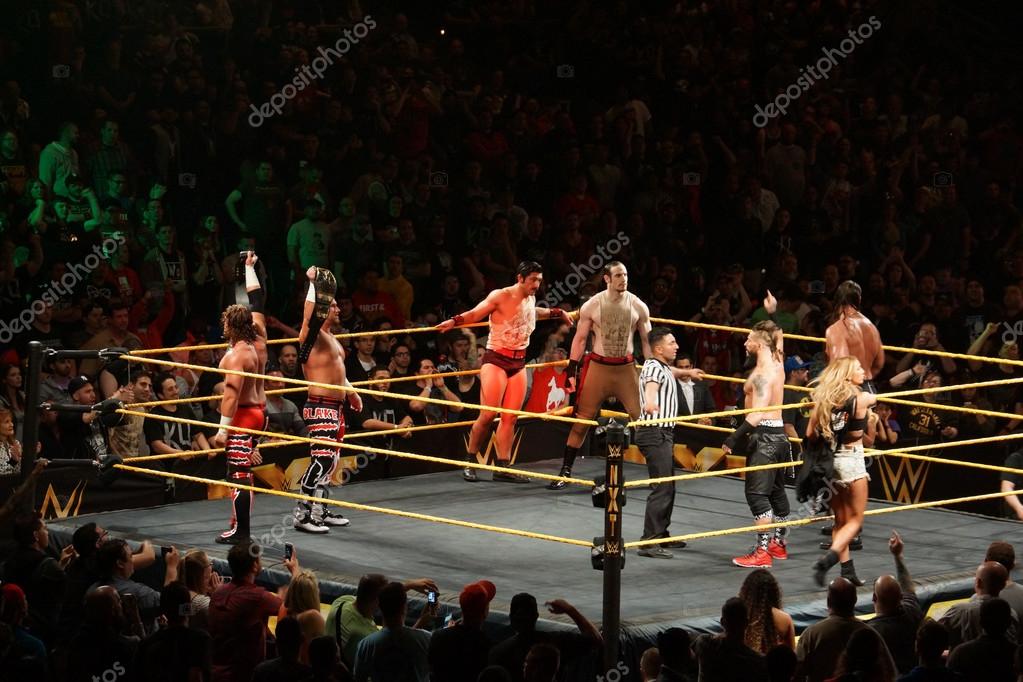 SAN JOSE - MARCH 27: NXT Tag Team Champions Blake and Murphy hold titles in the air with the vaudevillians and Enzo Amore, Big Cass in the ring at the San Jose Event Center in San Jose, California on March 27, 2015.