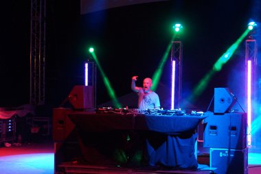 Moby points into crowd on stage during concert