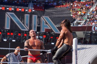 WWE Wrestler Seth Rollins gets crouched in top turnbuckle as Ran
