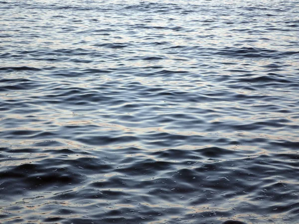 Dark blue Ocean Water ripples and reflects sunset — Stock Photo, Image