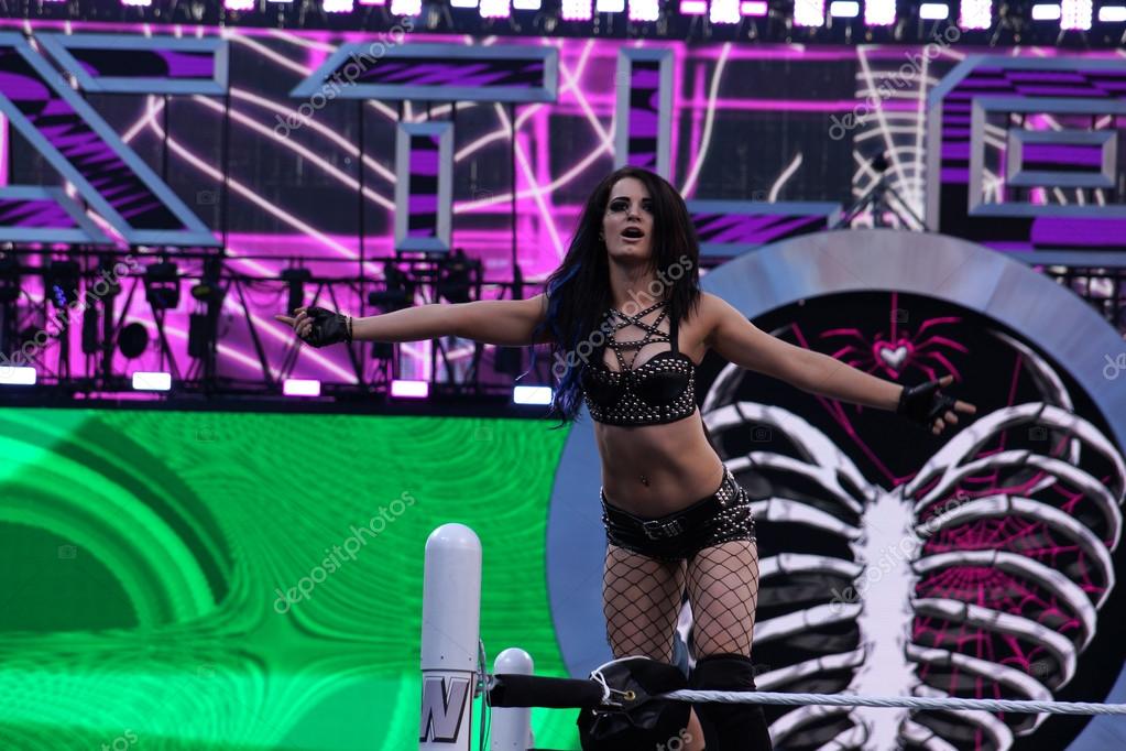 SANTA CLARA - MARCH 29: WWE Diva Paige stands on top the ropes with arms out in ring during entrance before tag match at Wrestlemania 31 at the Levi's Stadium in Santa Clara, California on March 29, 2015.