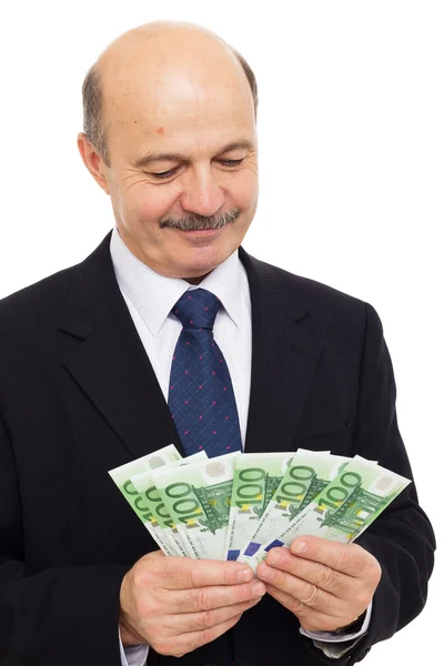 Älterer Mann zählt Geld — Stockfoto