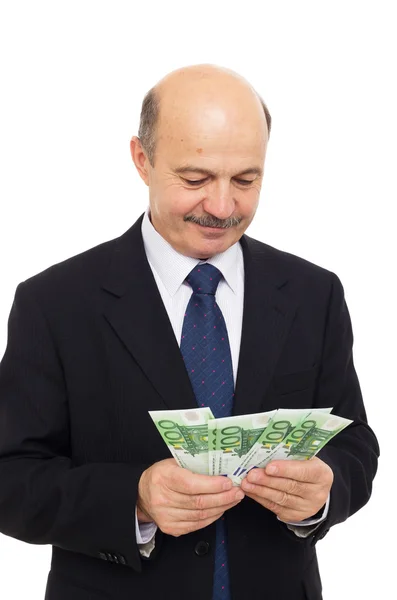 Älterer Mann zählt Geld — Stockfoto