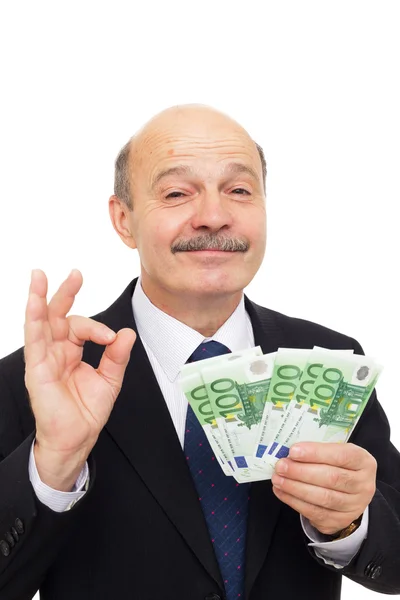 Zufriedene Geschäftsmann liebt Geld und schnüffelt sie mit Bewunderer — Stockfoto