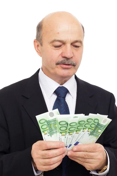 Anciano cuenta dinero — Foto de Stock