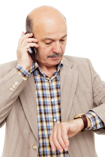 Elderly man complained looking at his watch, trying to call on the phone — Stock Photo, Image