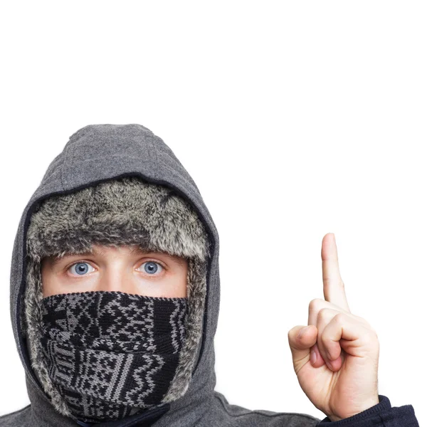 Blue-eyed boy wrapped in a hood gives advice. Index finger upwar Royalty Free Stock Images