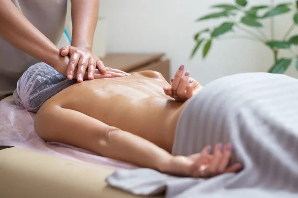 Caucasian woman getting a spine massage in the spa salon — Stock Photo, Image