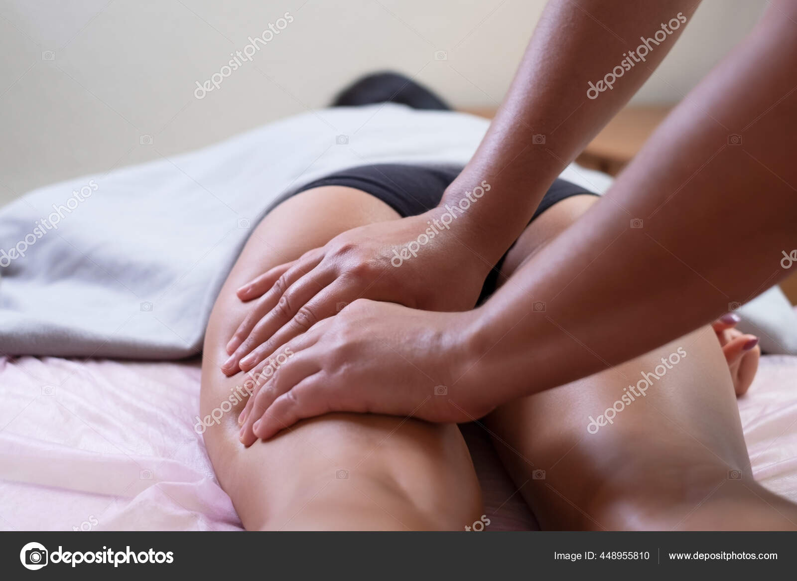 Caucasian woman getting a leg massage in the spa salon photo
