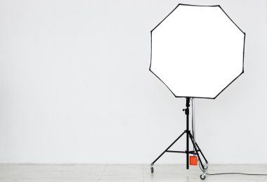 Photographic lighting in an empty studio clipart