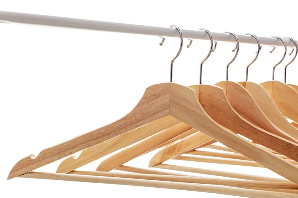 Houten heldere hangers voor jas en jurk op de pijnbank — Stockfoto