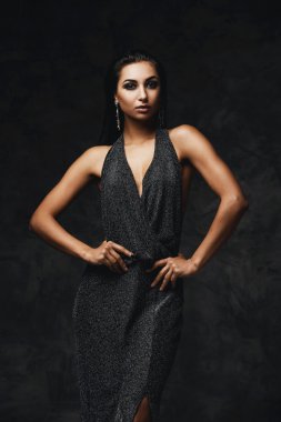 sexy raven indian lady posing seductively in front of camera