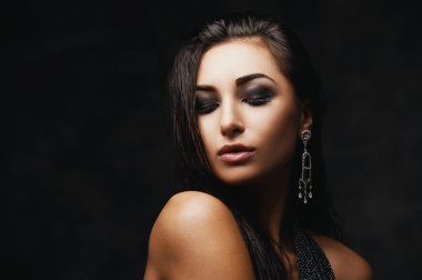 sexy raven indian lady posing seductively in front of camera