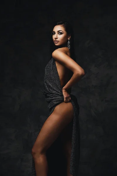 sexy raven indian lady posing seductively in front of camera