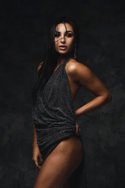 sexy raven indian lady posing seductively in front of camera