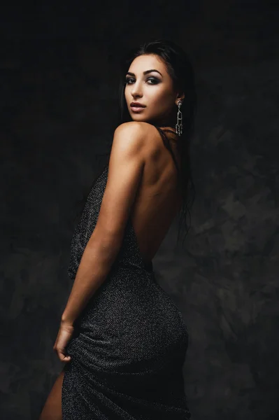 sexy raven indian lady posing seductively in front of camera