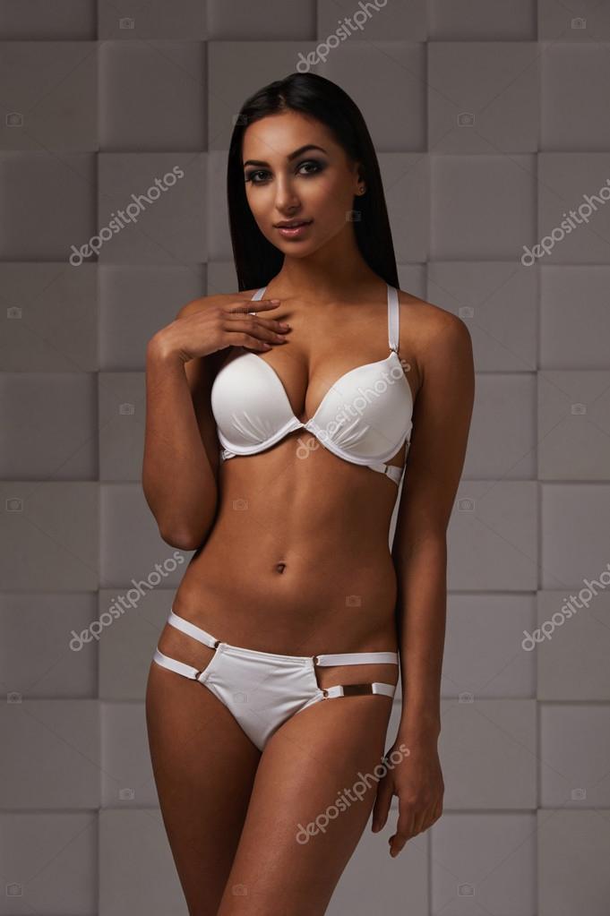 Black haired indian lady in white swimsuit Stock Photo by ©dmitryzubarev  100850022