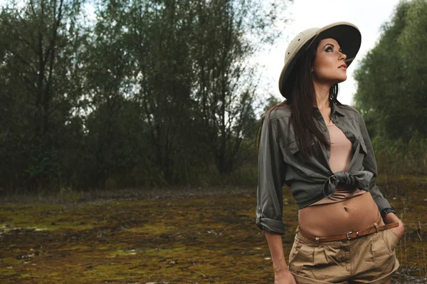 Safari woman in  the morning swamp — Stock Photo, Image