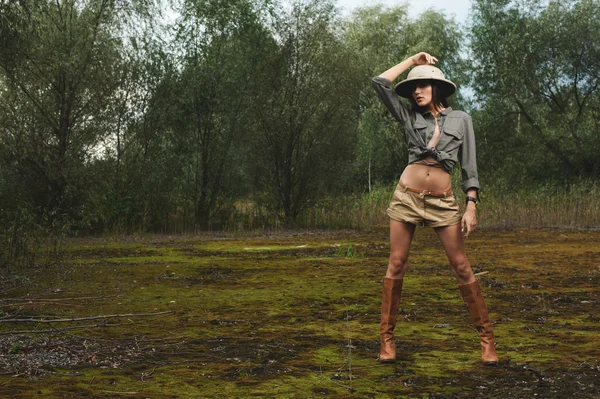 Safari woman in  the morning swamp — Stock Photo, Image