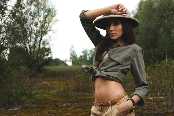 Safari woman in  the morning swamp — Stock Photo, Image