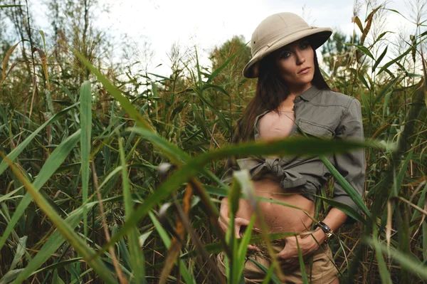 Safari woman in swamp — Stock Photo, Image