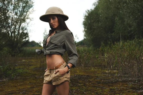 Safari woman in  the morning swamp — Stock Photo, Image