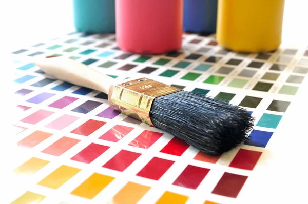 Paint brushes and color tubes — Stock Photo, Image