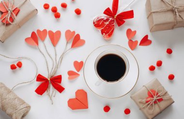 Flat lay Happy Valentine's Day photography with gift box and paper origami heart. Romantic greeting card.