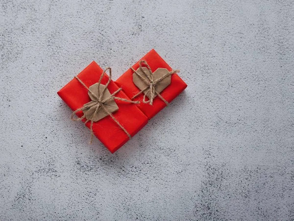 Romantic photography with gift box and paper origami heart on natural background. Romantic greeting card.