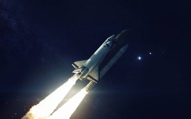 Uzay mekiği Dünya 'nın yörüngesinde dönüyor. Bu görüntünün elementleri NASA tarafından desteklenmektedir