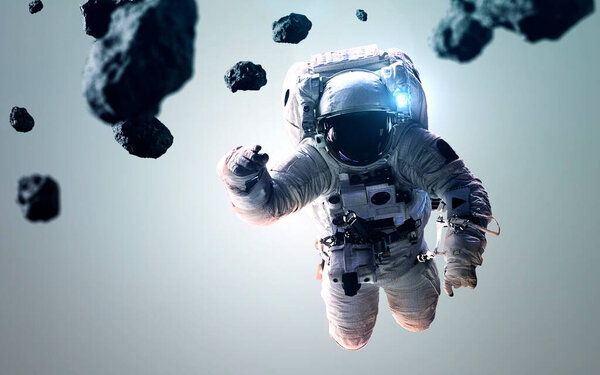 Science fiction space wallpaper with astronaut at the spacewalk. Elements of this image furnished by NASA